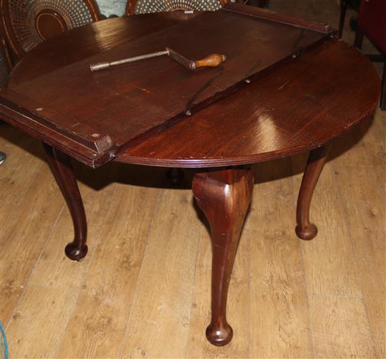 A 1920s mahogany extending dining table